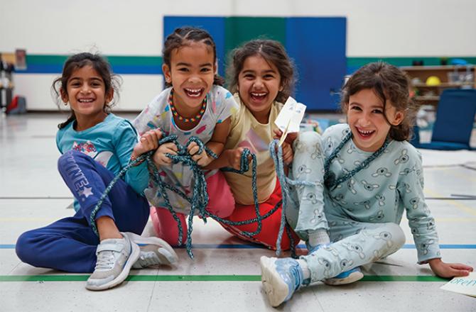 four children smiling