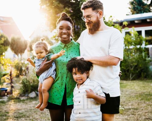 A family standing on a lawn
