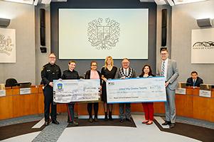 United way group holding two cheques