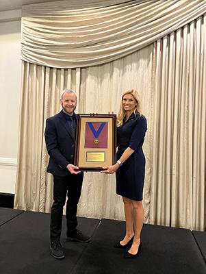 Kealy Deadman receiving award from Andrew Stevenson President of the Canadian Public Works Association.