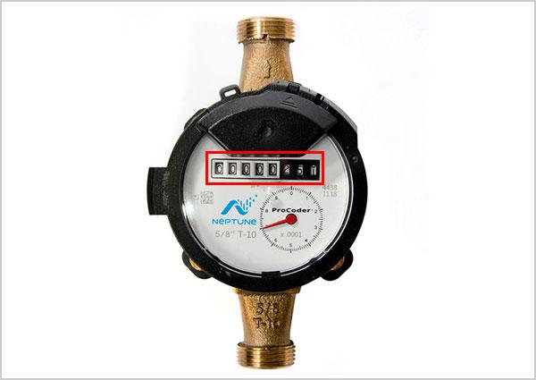Water meter with 3 black wheels with odometer highlighted