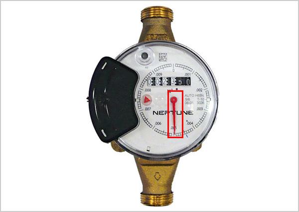 Water meter with 2 black wheels with sweep hand highlighted