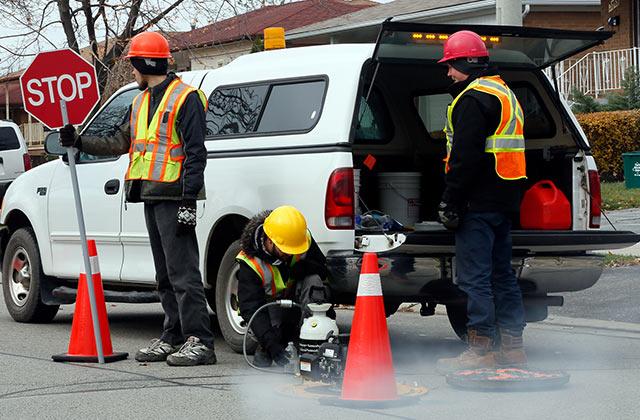 Public work employees working outdoors